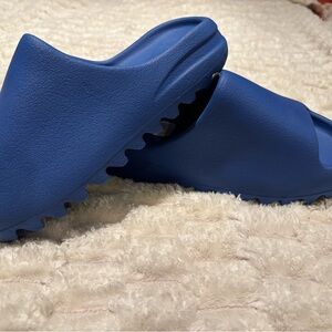 Yeezy slides in rare cobalt blue